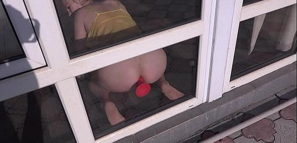 Anal masturbation at the window. Busty babe fucks juicy ass and shakes big boobs doggy style. Homemade fetish and gaping ass.